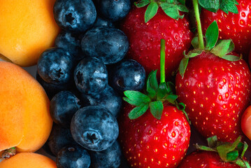 Fresh and juicy berries top view. Berries and fruits. Selective focus.