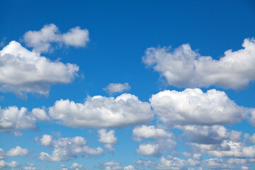 Naklejka na ściany i meble Blue summer sky with white clouds.