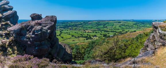 A view between rock stacks on the summit of the Roaches escarpment, Staffordshire, UK in summertime