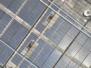 Obraz premium solar panels on factory rooftop