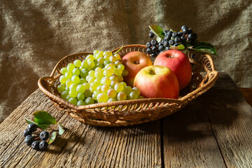 Ripe fruits and berries on a wooden table