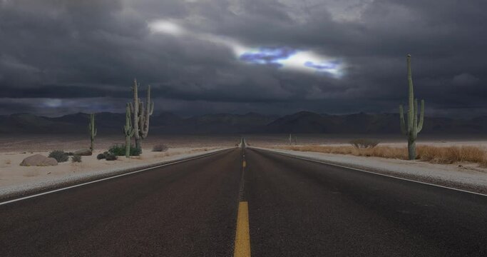 Animated landscape, looking down a desert highway with cactus, mountains, and a lightning storm in the distance