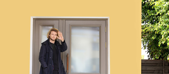 young man opening the door of his house.Inviting the guests