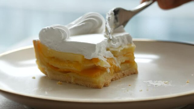  half eaten a slice of cheese cake 
