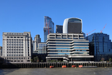 Fototapeta na wymiar London, United Kingdom - 11.08.2022: View of the City financial district of London across the Thames river