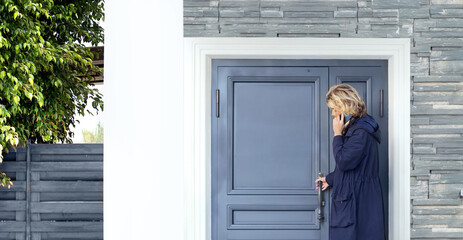 young man opening the door of his house.Inviting the guests