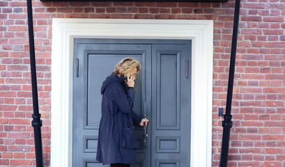 young man opening the door of his house.Inviting the guests
