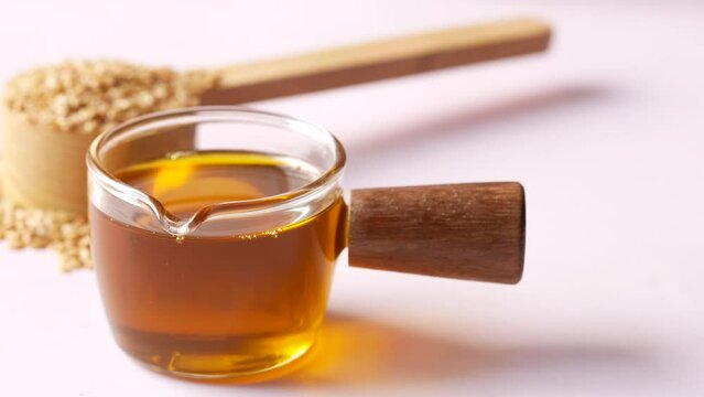 Mustard oil and seed in a glass jar 