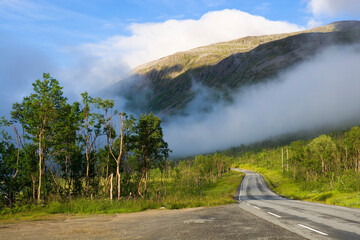 View of foggy mountains on Kvaloya island, Norway