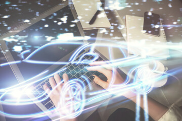 Double exposure of woman hands typing on computer and automobile theme drawing. High Tech concept.