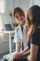 Close up hands Woman doctor holding hands patient encourage cheer up a consultation at hospital...
