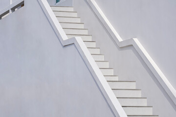Background of white staircase with concrete railing outside of modern building