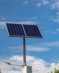 Solar panels above the highway to illuminate the road. Renewable energy with the help of the sun.