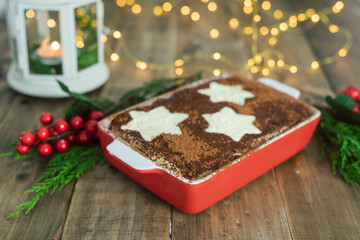 Tiramisu traditional Italian dessert with Christmas decoration. Copy space.