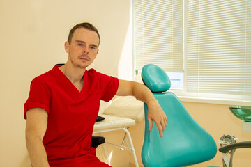 doctor dentist in a red suit resting from work
