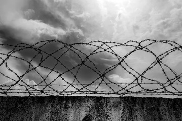 Prison. Prison wall with barbed wire. Law and justice