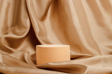 Geometric podium with golden silk smooth textile background. Display for cosmetic and product...