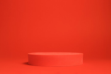 Red cylinder podium on red background, sale and black friday concept, minimal sale background for product presentation