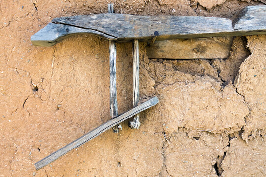 Old Broken Cow Yoke Hangs On The Dilapidated Barn Wall. Adobe RGB Color Space