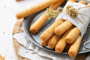 Bread sticks with sesame seeds.
