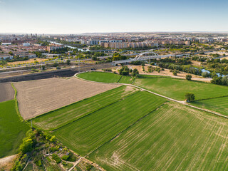 Fototapeta na wymiar Aerial view of agricultural landscape with the Railroad Bridge