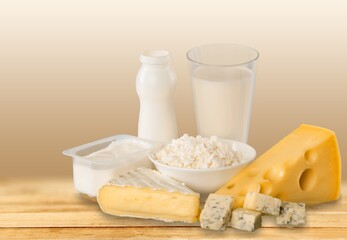 Shavuot with dairy products on light background, Happy Jewish Shavuot holiday frame with dairy foods