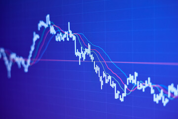 Falling stock market chart on blue background
