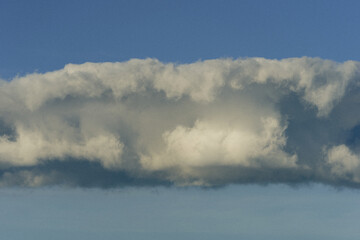 A cloud formed above Lake Mjøsa in the evening light.