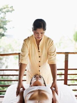 Woman Receiving Marma Point Therapy.  Koh Samui, Thailand.