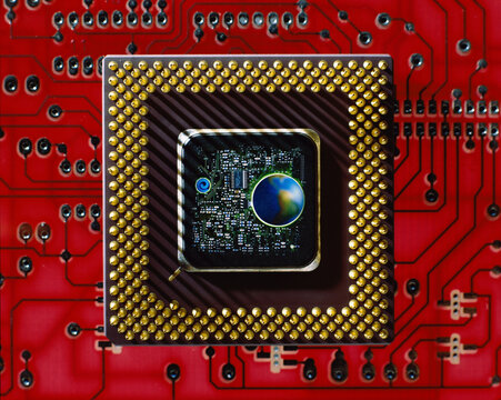 Close-up of a globe in the center of a computer chip