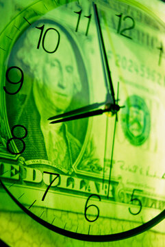 Clock superimposed over a American dollar bill