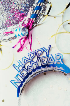 Sequined hat with a Happy New Year sign and streamers