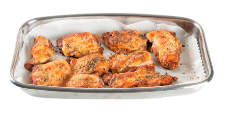 Baking pan with pieces of roasted chicken covered in cheese. PNG transparent background