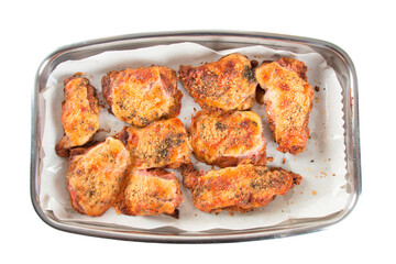 Baking pan with pieces of roasted chicken covered in cheese. PNG transparent background