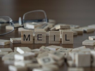 meil palabra o concepto representado por baldosas de letras de madera sobre una mesa de madera con...