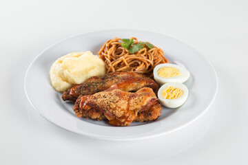 Lunch food plate. Pasta with roasted chicken, puree and eggs