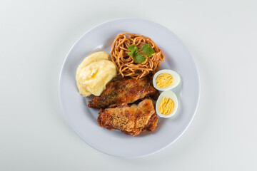 Lunch food plate. Pasta with roasted chicken, puree and eggs