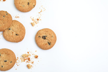 Tasty homemade cookies with raisins on white background, top view