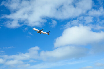 Fototapeta na wymiar Beautiful view of modern airplane in blue sky. Space for text