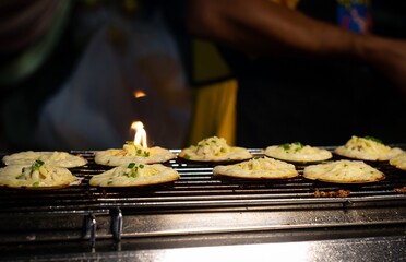 Cooking Grilled Scallops with Cheese.