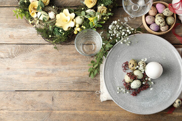 Fototapeta na wymiar Festive Easter table setting with beautiful floral decor, flat lay. Space for text