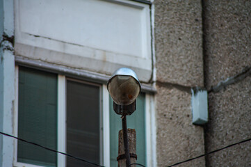 street light lamppost on a blue sky. daytime streetlight. lantern street lighting against day time sky. street lamp on metal pole. lamp street lighting is off.