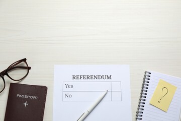 Flat lay composition with referendum ballot on white wooden table. Space for text