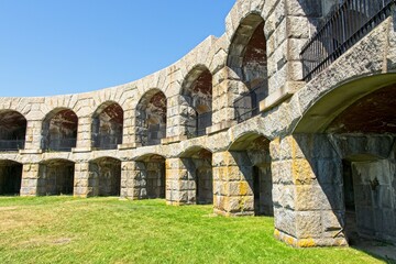 Fort Popham semi-circular granite walled casemates viewed from parade grounds