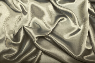 Beige gold pearl wave fabric silk. Abstract texture horizontal copy space background.