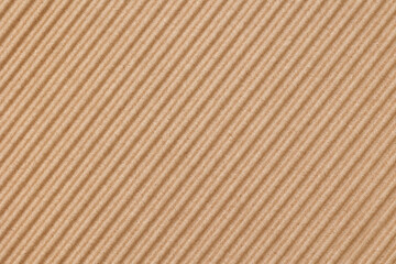 Top view of a corrugated cardboard sheet, brown color, the sheet is orientated diagonally