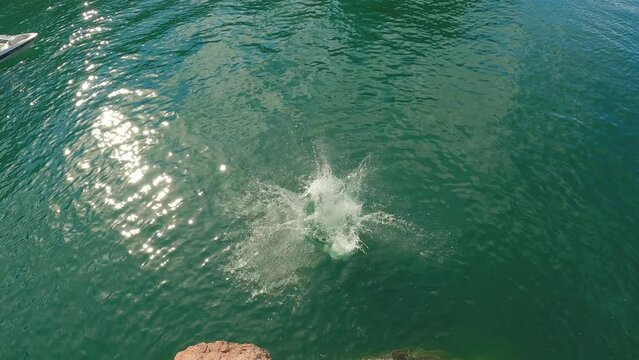 Man Cliff Jumping Lake Roosevelt with Slow Motion Backflip