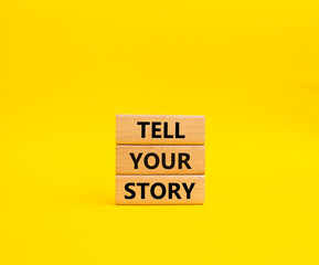 Tell your story symbol. Wooden blocks with words Tell your story. Beautiful yellow background. Business and Tell your story concept. Copy space.