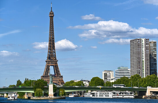 Paris,France.June 2022.Amazing shot that collects two symbols of France: the Eifell tower and the statue of liberty at the base.An iconic image of the city on a beautiful summer day