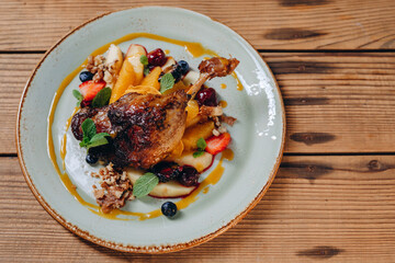 There are a interesting plate with ornament and with the dish on it.